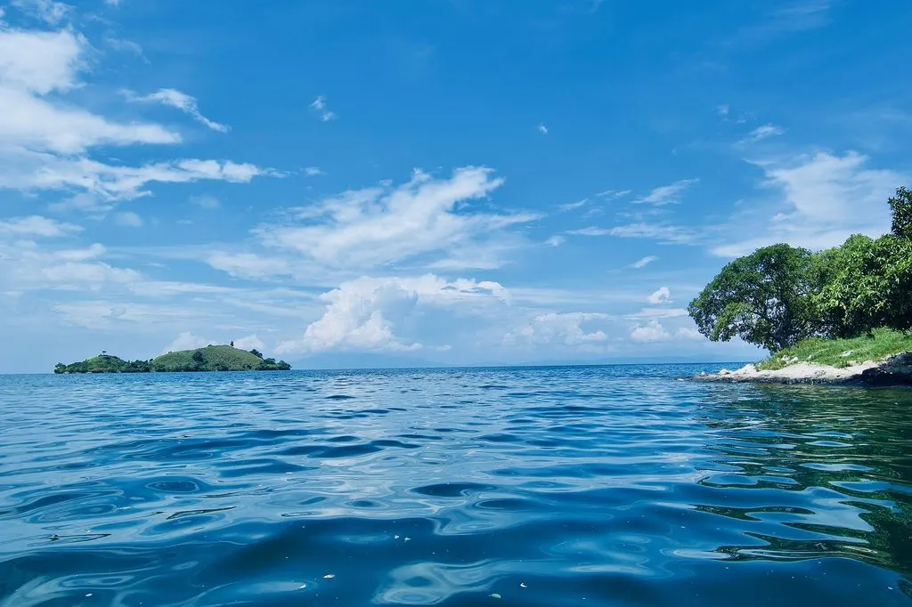Lake Kivu with forested islands under a blue sky