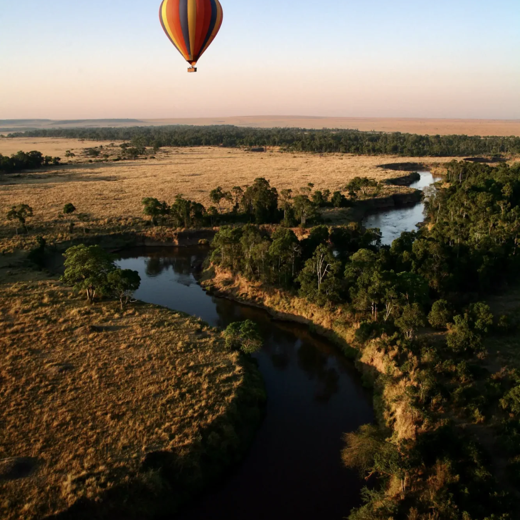 A balloon seen from above over a river